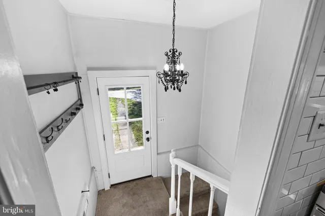 a view of a livingroom with a white & door