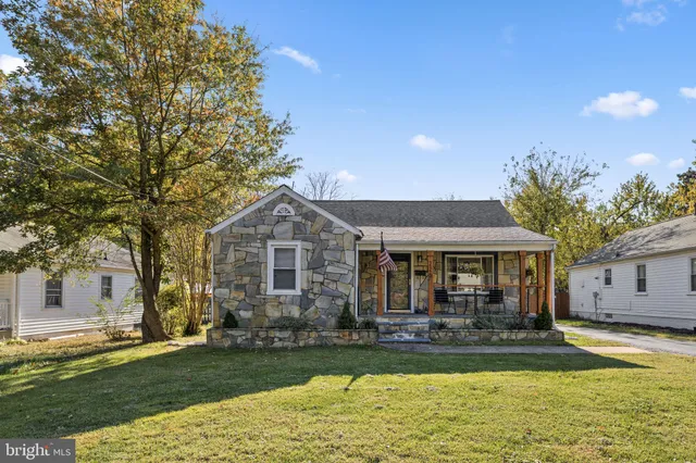 a front view of a house with swimming pool and a yard