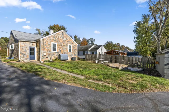 a front view of a house with a yard and porch