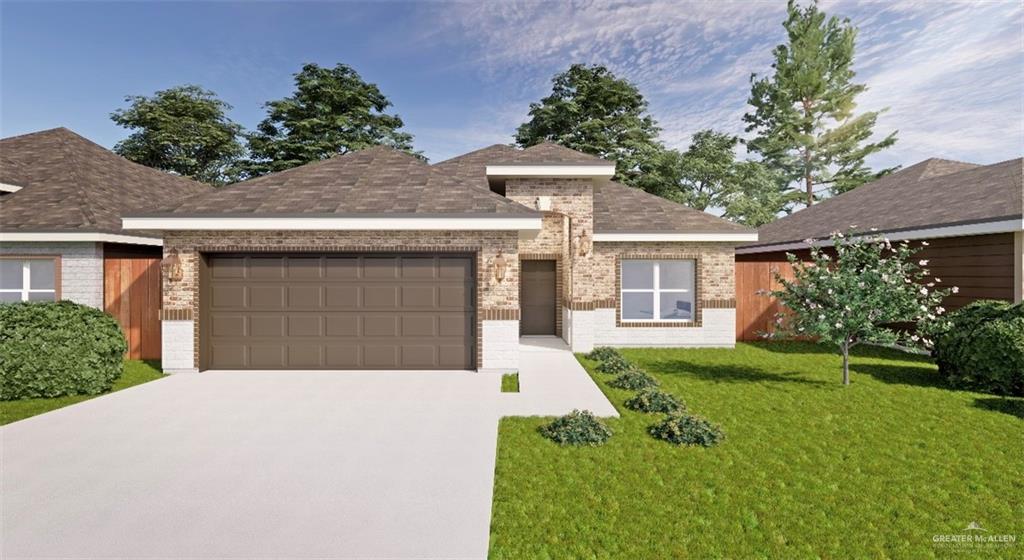 2206 North 26th Street Hidalgo, TX 78557 - Photo 1 of 1 a front view of a house with a yard and garage