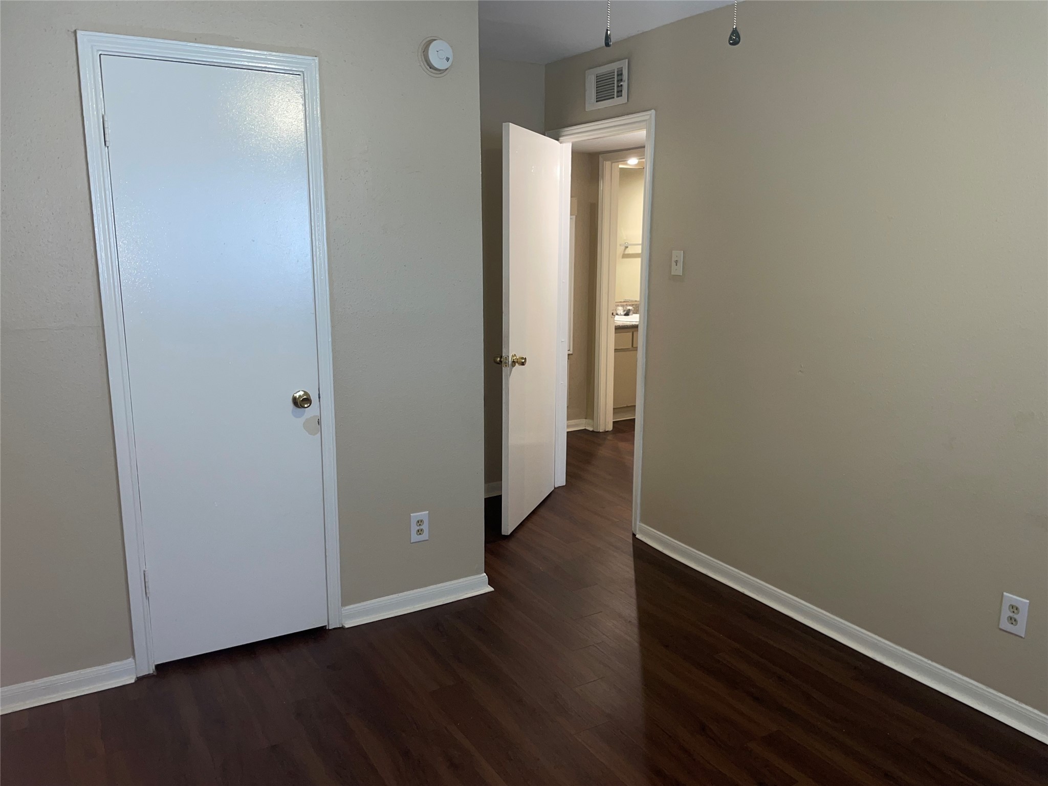 4710 Airport Boulevard, Unit 206 Houston, TX 77048 - Photo 12 of 17 an empty room with wooden floor and closet
