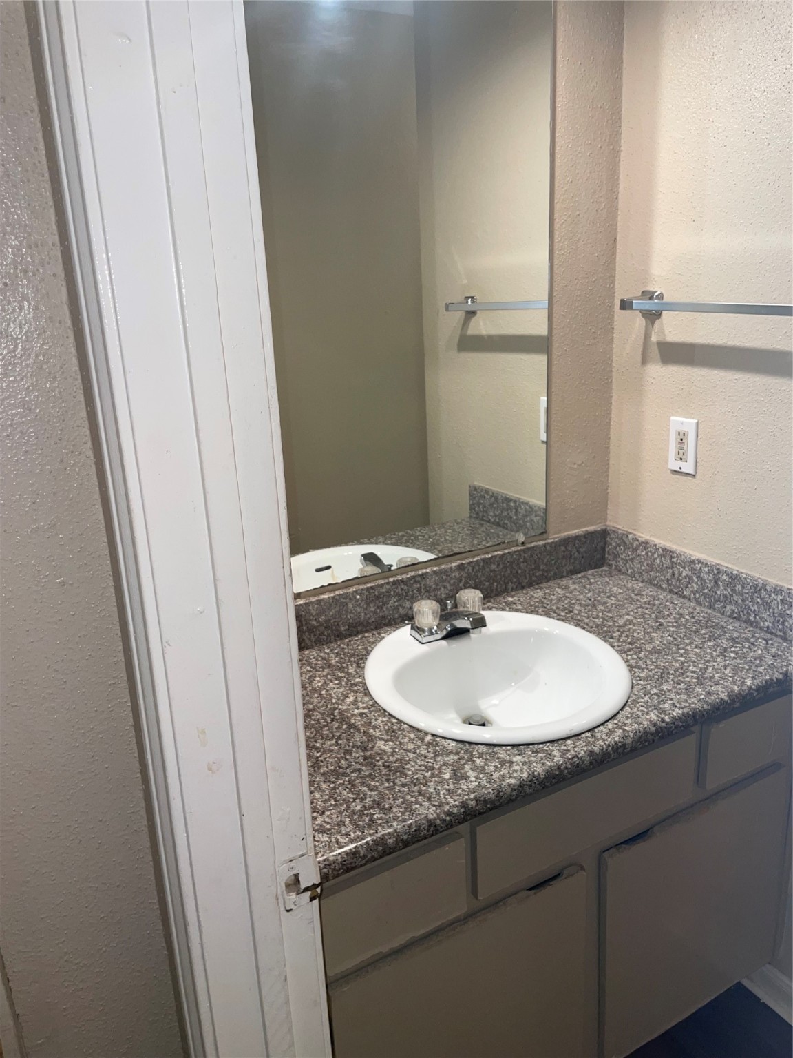 4710 Airport Boulevard, Unit 206 Houston, TX 77048 - Photo 16 of 17 a bathroom with a sink and a mirror
