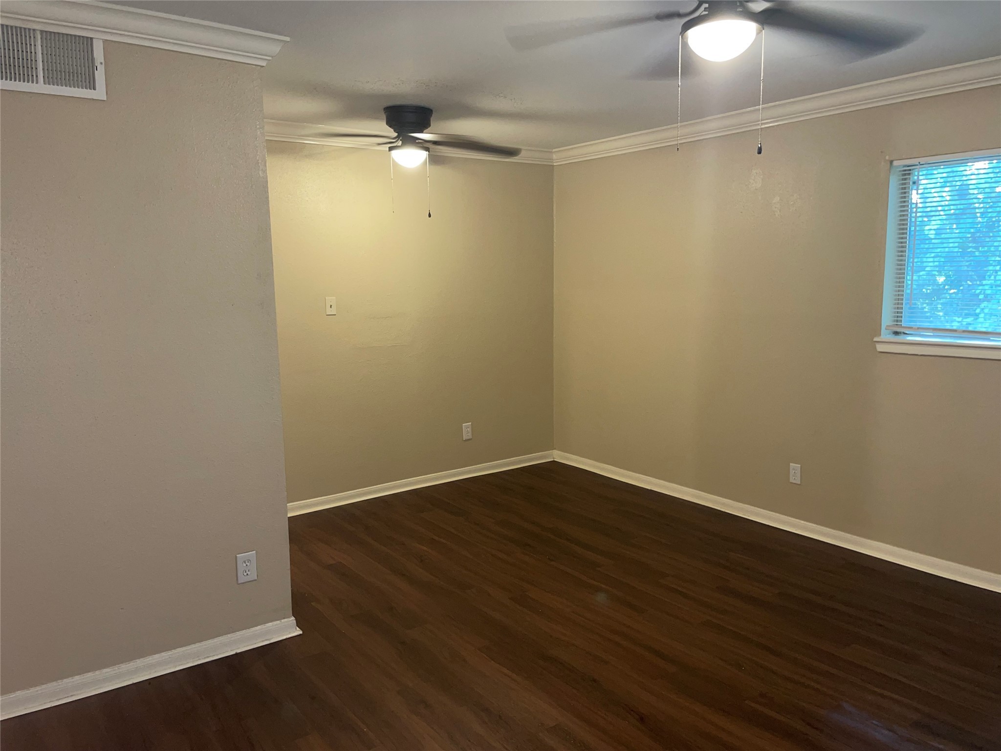 4710 Airport Boulevard, Unit 206 Houston, TX 77048 - Photo 3 of 17 wooden floor in an empty room with a window