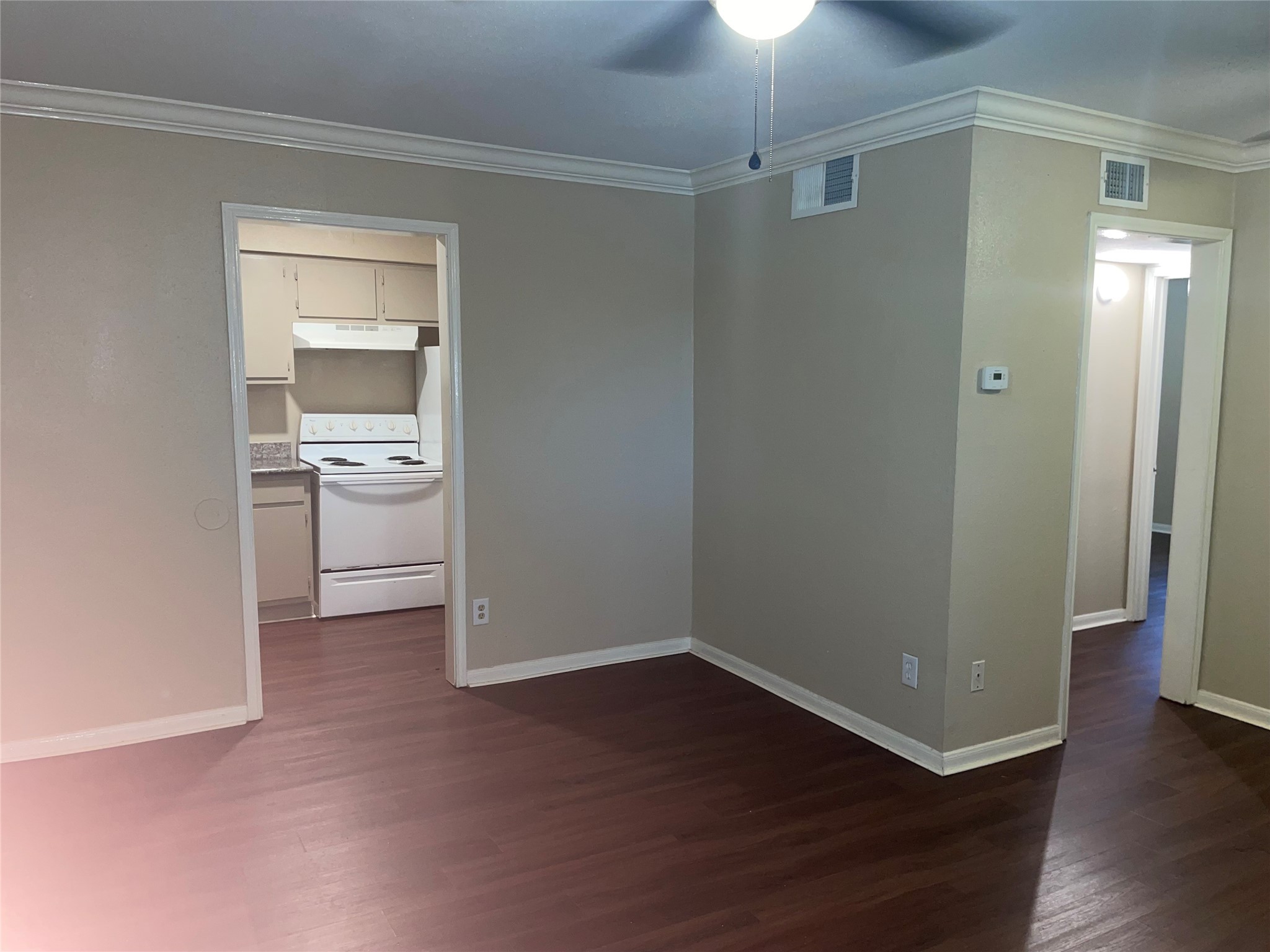 4710 Airport Boulevard, Unit 206 Houston, TX 77048 - Photo 5 of 17 wooden floor in an empty room with a bathroom