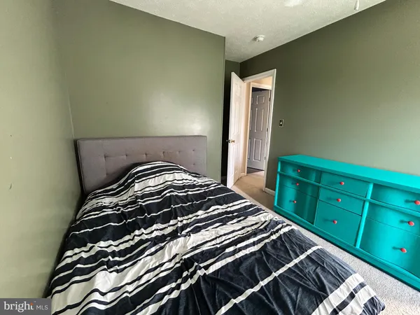 a bedroom with a bed