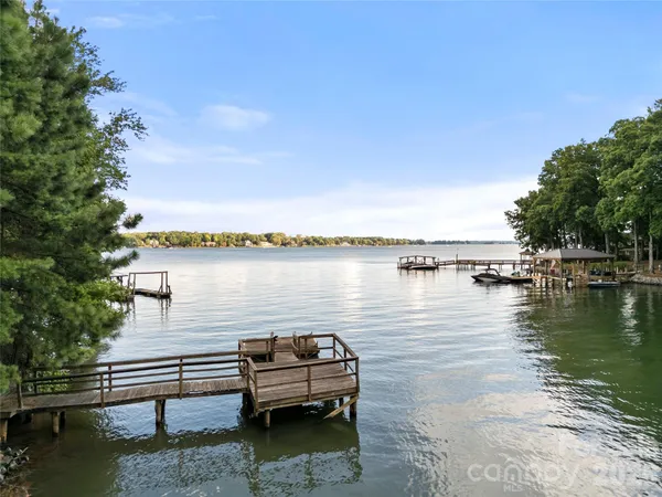 a view of a lake with outdoor seating space
