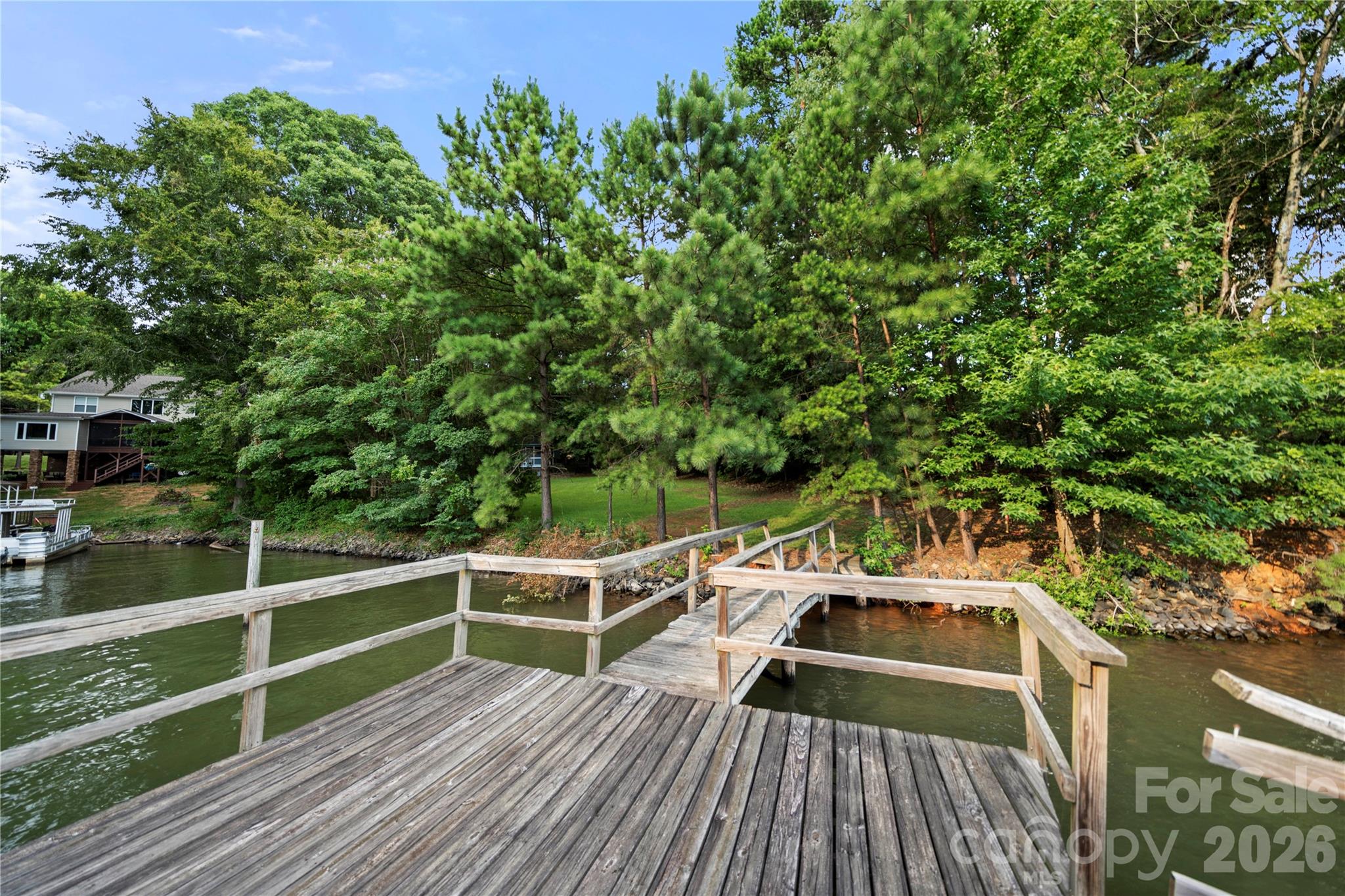 3766 Gordon Street, Unit 48 Terrell, NC 28682 - Photo 9 of 16 a view of a balcony with wooden floor and fence