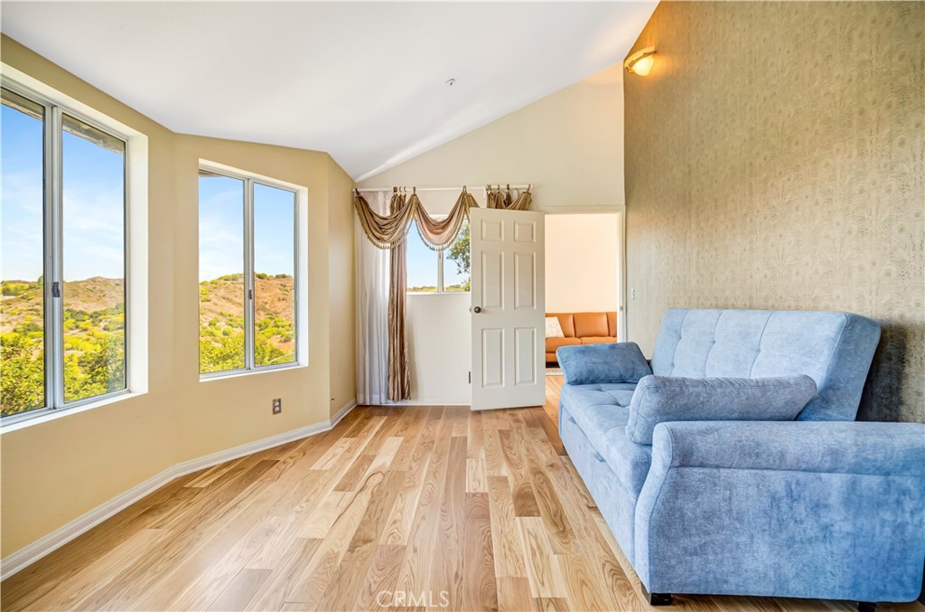 22011 Callado Way Topanga, CA 90290 - Photo 13 of 49 a living room with furniture and a large window