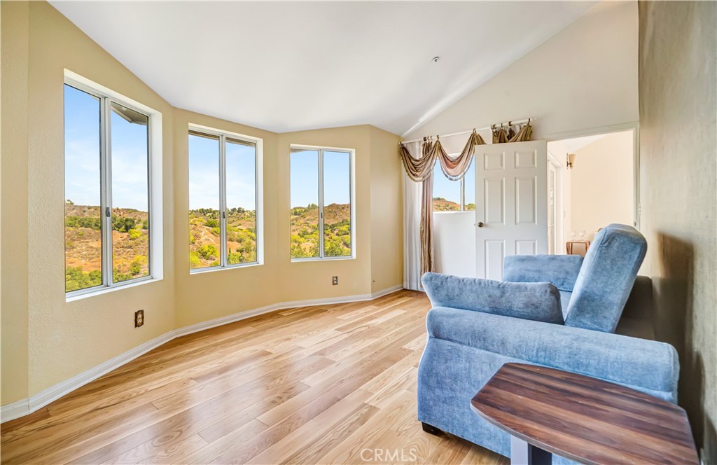 22011 Callado Way Topanga, CA 90290 - Photo 14 of 49 a living room with furniture and a large window
