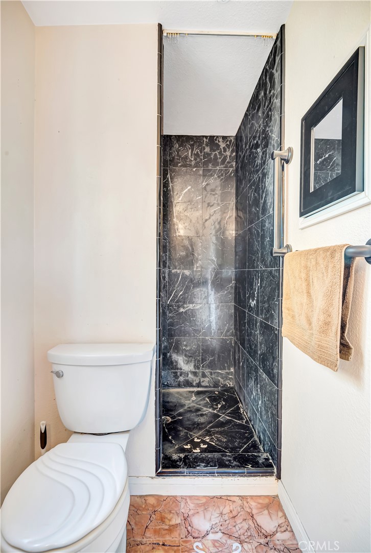22011 Callado Way Topanga, CA 90290 - Photo 19 of 49 a bathroom with a toilet and shower