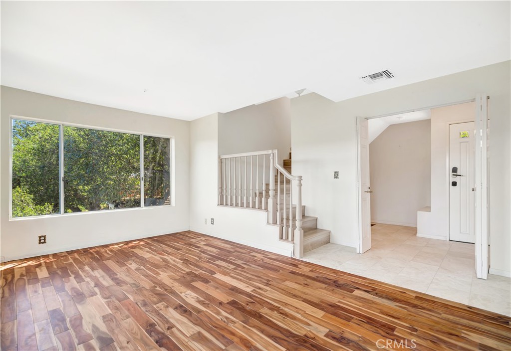 22011 Callado Way Topanga, CA 90290 - Photo 27 of 49 a view of empty room with wooden floor and fan