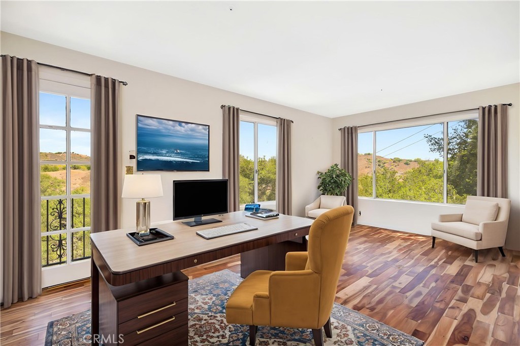 22011 Callado Way Topanga, CA 90290 - Photo 32 of 49 a view of a workspace with furniture and a window