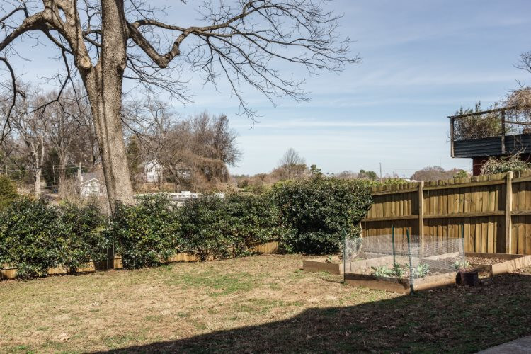 504 Cleveland Street Raleigh, NC 27605 - Photo 3 of 25 The level 0.14 acre lot provides off street parking in front and a fenced, level lot in back.