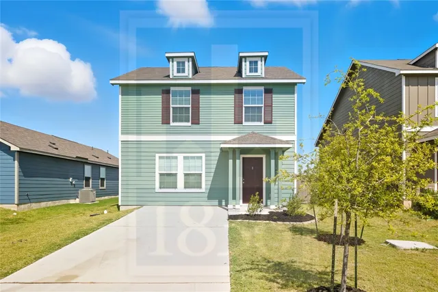 a view of house with swimming pool