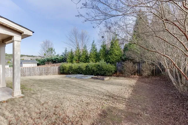 a backyard of a house with lots of green space