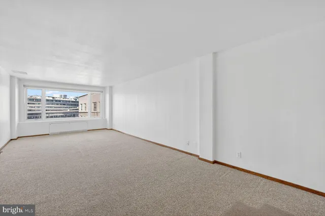 an empty room with entrance door