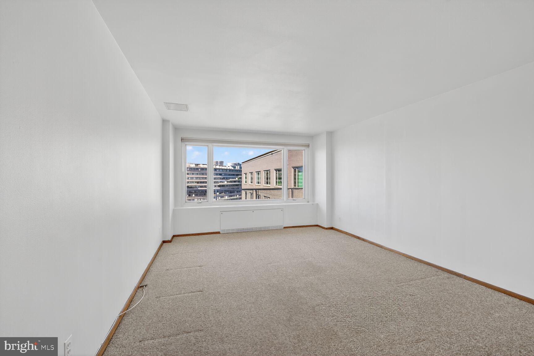 2475 Virginia Avenue Northwest, Unit 925 Washington, DC 20037 - Photo 13 of 45 an empty room with entrance door