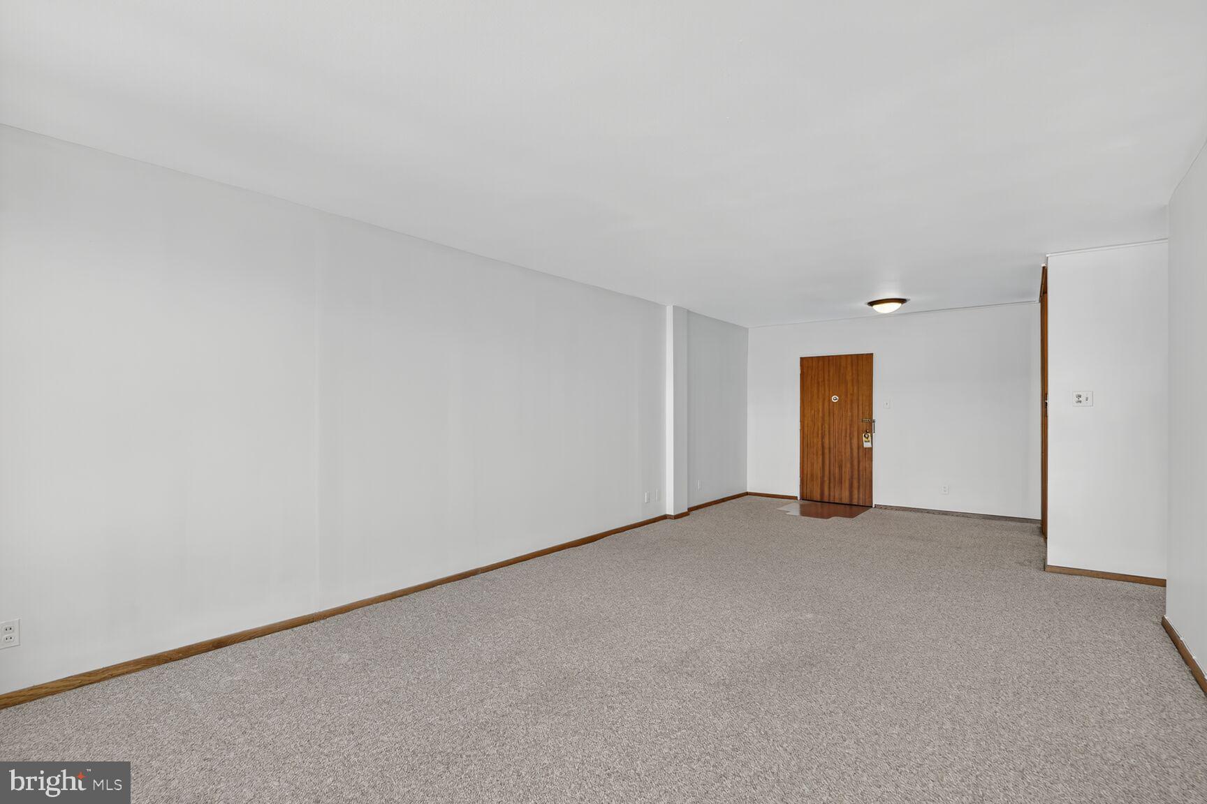 2475 Virginia Avenue Northwest, Unit 925 Washington, DC 20037 - Photo 14 of 45 a view of an empty room and a window