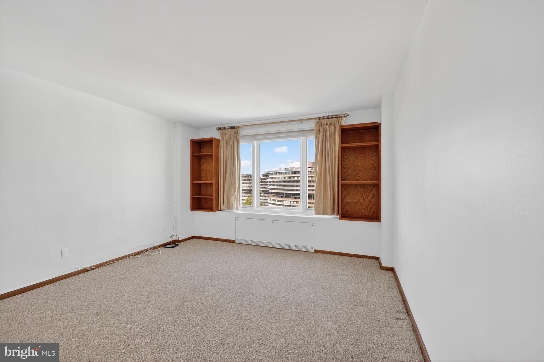 2475 Virginia Avenue Northwest, Unit 925 Washington, DC 20037 - Photo 21 of 45 wooden floor in an empty room with a window