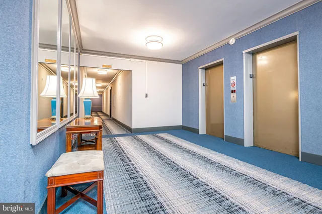 a spacious bedroom with a bed and a window