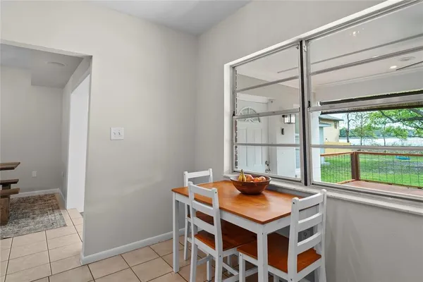 a dining room with a table and chairs