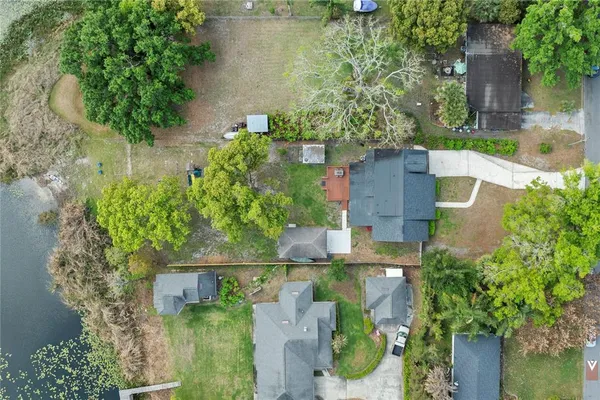 an aerial view of a house with a yard
