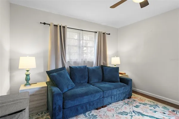 a living room with furniture and a window