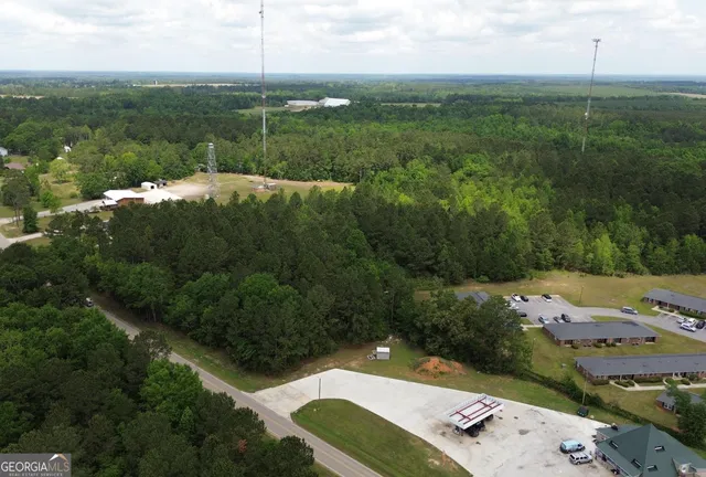 an aerial view of a house with yard
