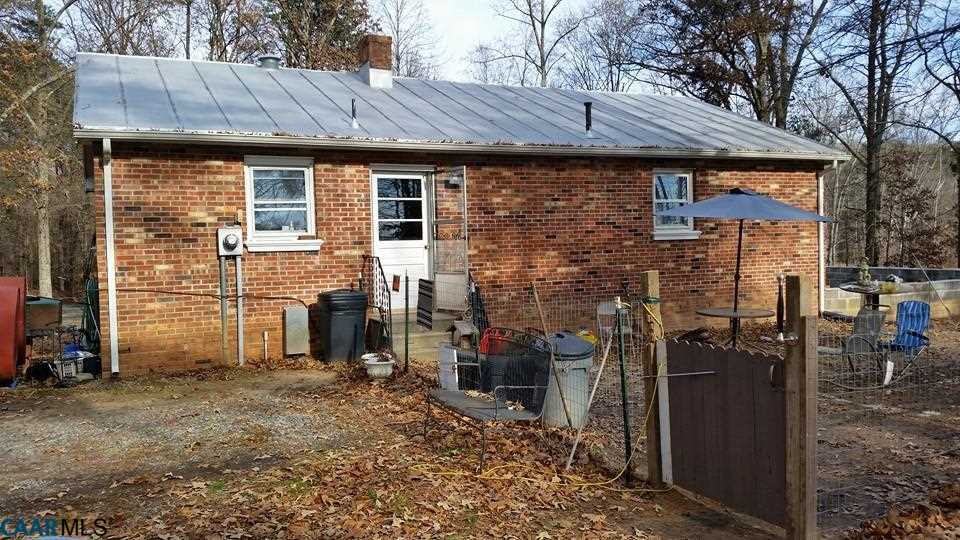385 Fredericks Hall Road Bumpass, VA 23024 - Photo 22 of 27 a view of a house with brick walls