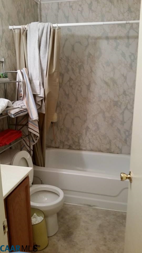 385 Fredericks Hall Road Bumpass, VA 23024 - Photo 27 of 27 a bathroom with a toilet and a shower
