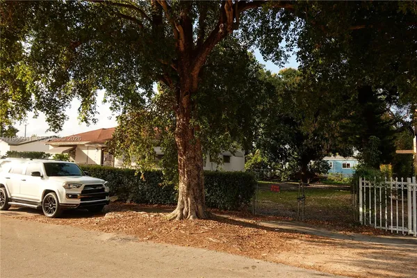 a view of street with parked cars