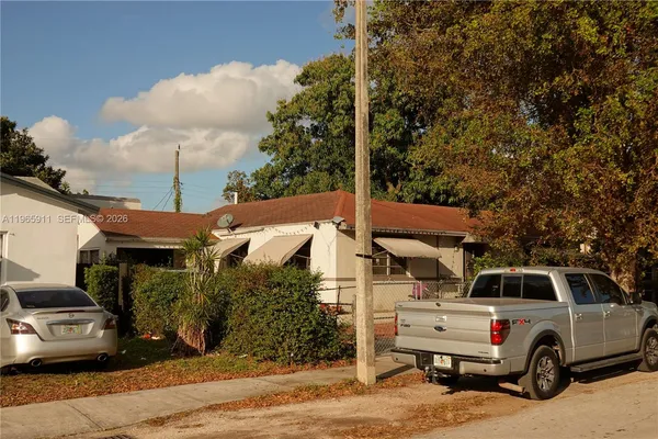 a car parked in front of a house
