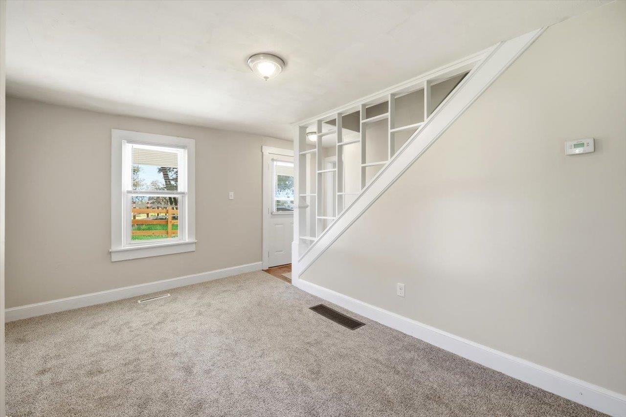 5096 Battlefield Road Harrisonburg, VA 22801 - Photo 11 of 38 a view of room with window and stairs