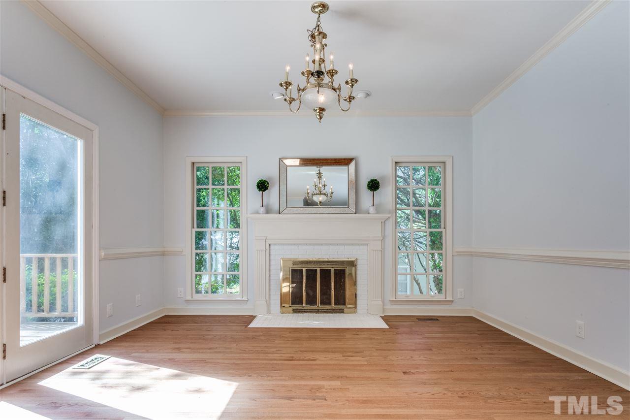 2915 Buckingham Road Durham, NC 27707 - Photo 15 of 25 a view of an empty room with a fireplace and a window