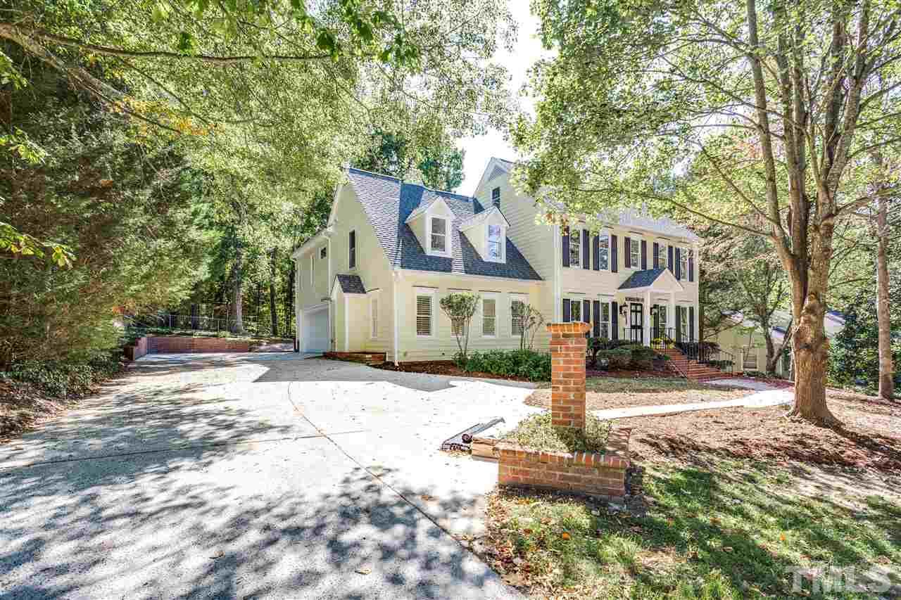 2915 Buckingham Road Durham, NC 27707 - Photo 3 of 25 a front view of a house with a yard and fountain