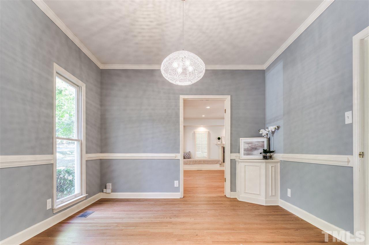 2915 Buckingham Road Durham, NC 27707 - Photo 6 of 25 a view of a kitchen with wooden floor and a large window