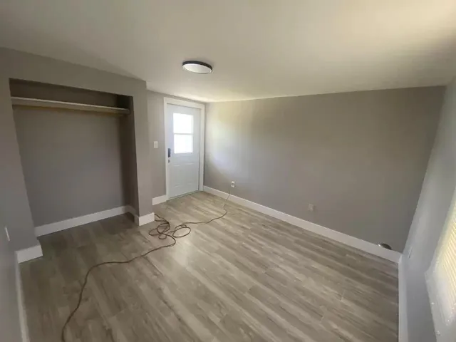 a view of livingroom with an empty space and window