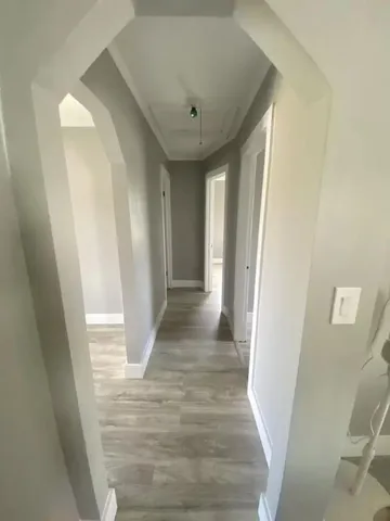 a white bath tub sitting next to a toilet