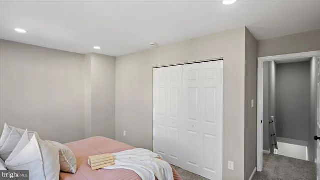 a bedroom with a bed and a shower