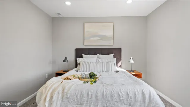 a bedroom with a bed and window