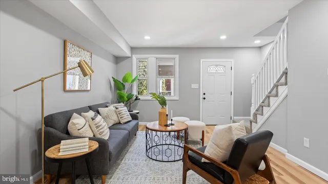 a living room with furniture and white walls