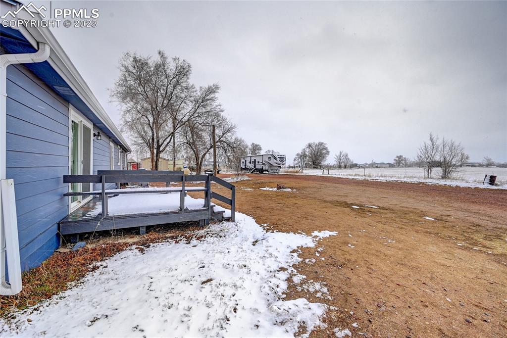 237 9th Street Penrose, CO 81240 - Photo 21 of 24 a view of a lake with a house in the background