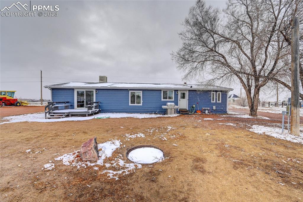 237 9th Street Penrose, CO 81240 - Photo 22 of 24 a view of a house with a yard and sitting area