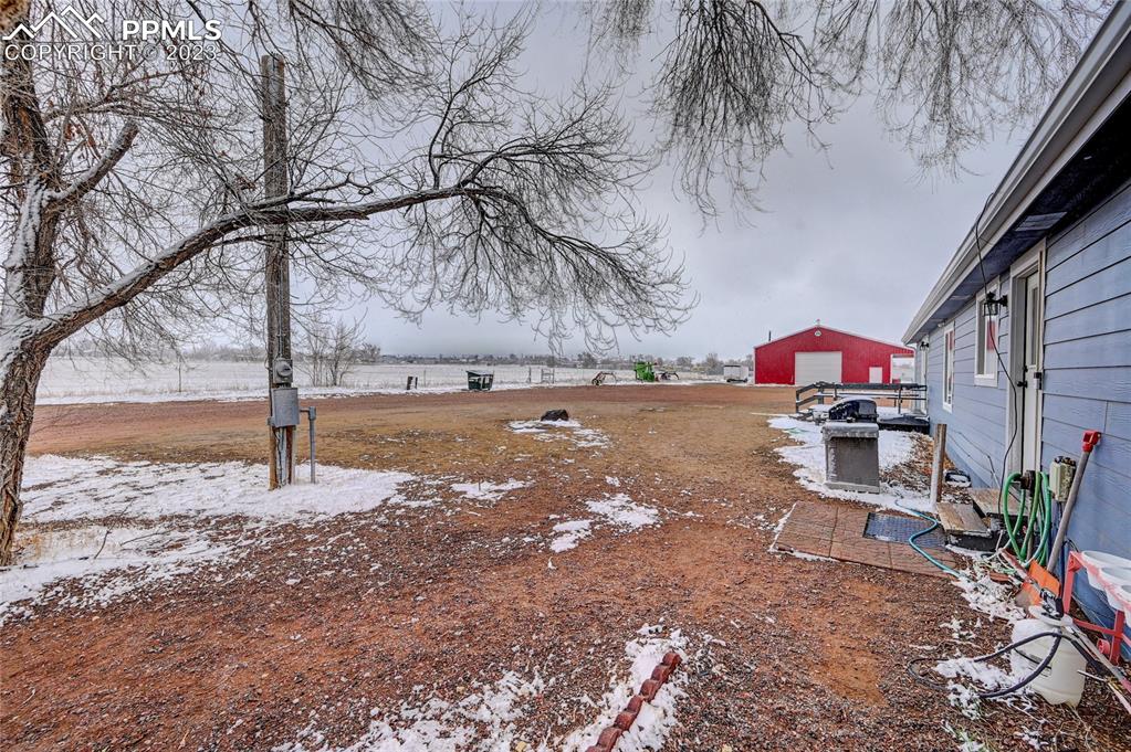 237 9th Street Penrose, CO 81240 - Photo 23 of 24 a view of a street with a bench and trees