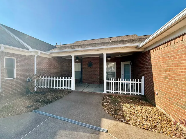 a view of porch with a bench