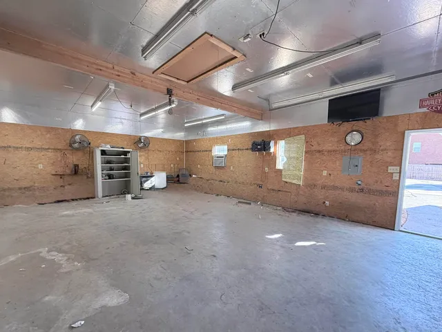 a view of a back yard with a door