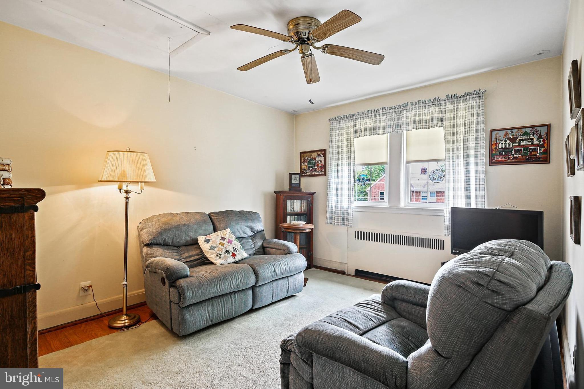48 Dunkirk Road Baltimore, MD 21212 - Photo 18 of 34 a living room with furniture ceiling fan and a window
