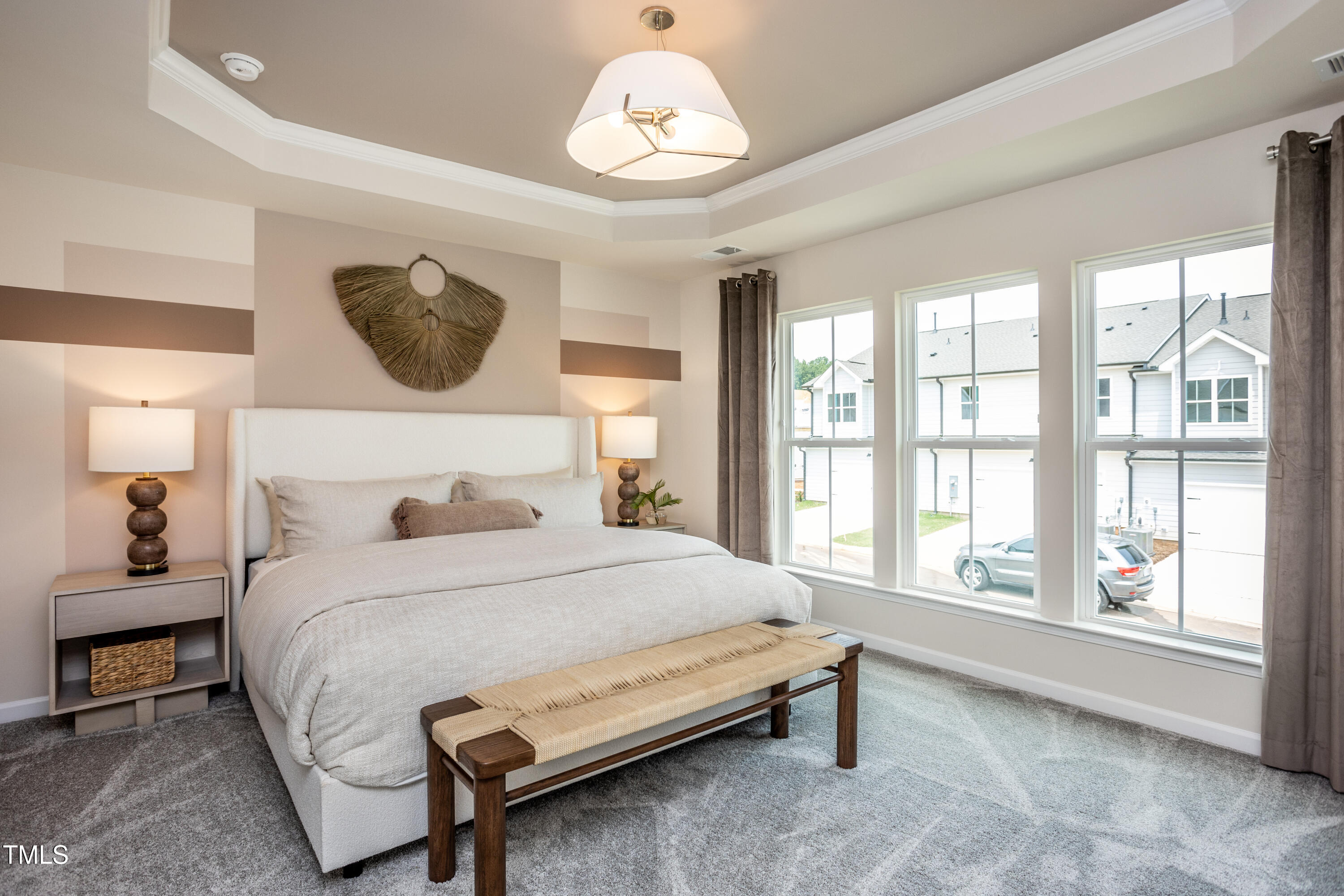 246 Broomside Avenue Raleigh, NC 27603 - Photo 11 of 24 a bedroom with a large bed and a large window