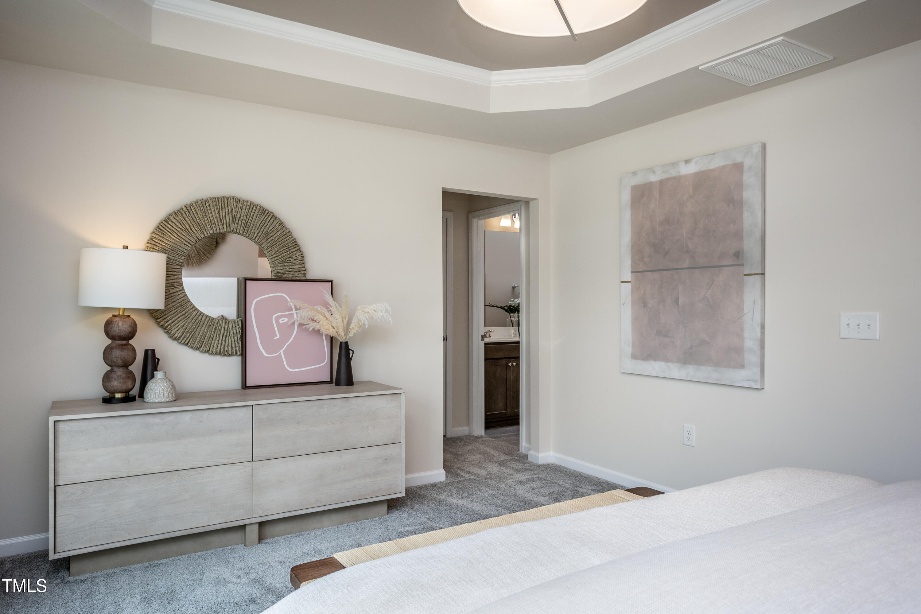 246 Broomside Avenue Raleigh, NC 27603 - Photo 12 of 24 a bedroom with a bed and a dresser