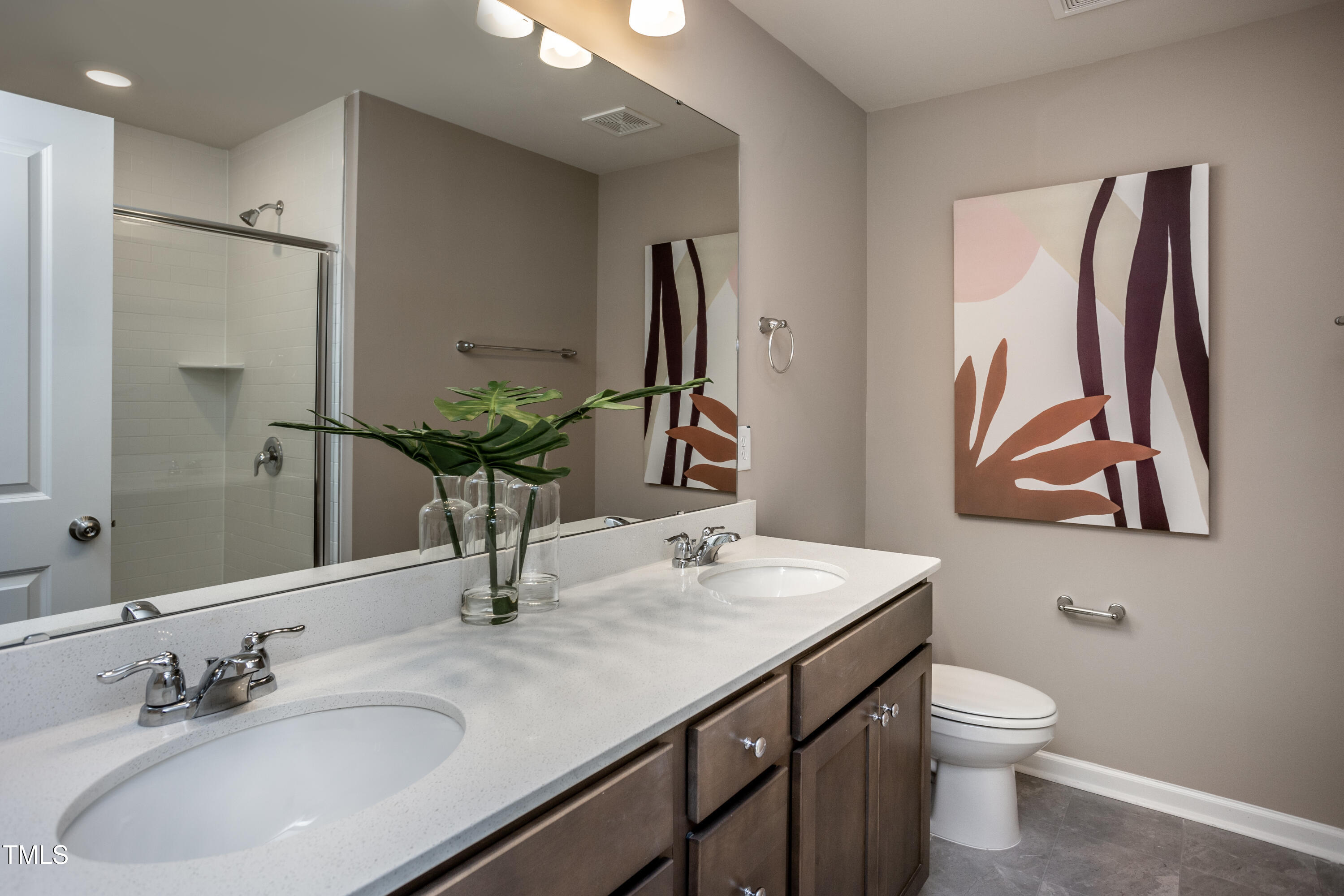 246 Broomside Avenue Raleigh, NC 27603 - Photo 13 of 24 a bathroom with a granite countertop sink and a mirror with toilet
